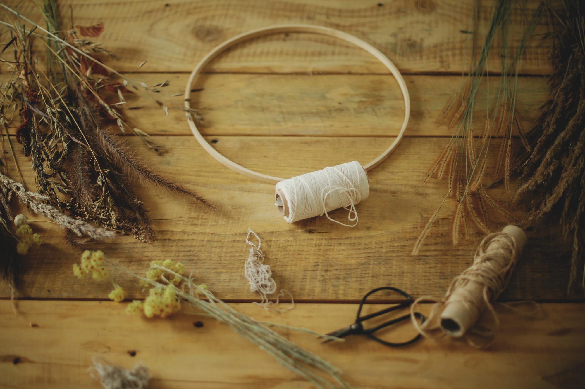 Workspace with threads, hoops, and natural light